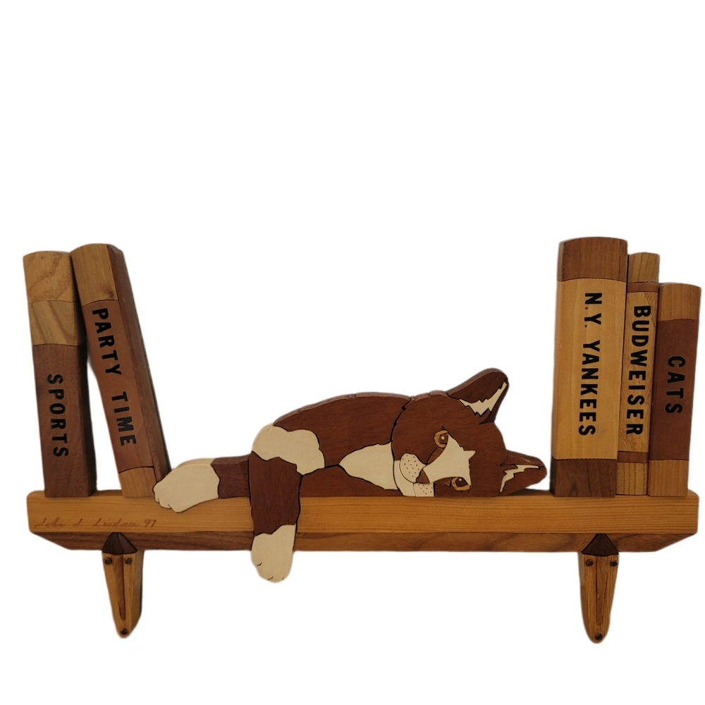 Hand-made wooden cat on shelf books New York Yankees baseball theme wall decor.